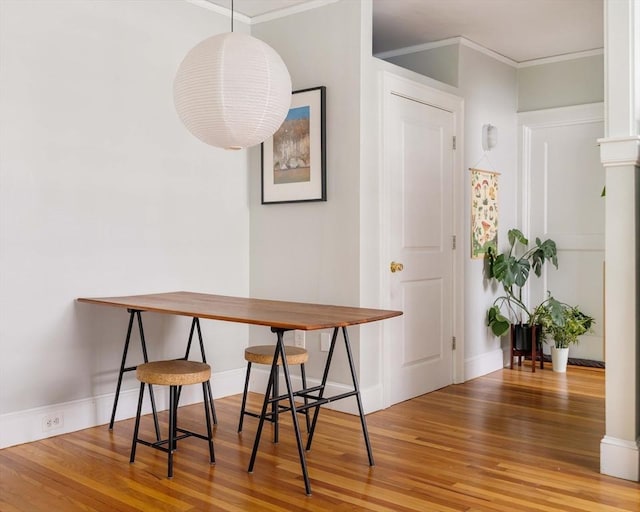 9 Ellery St Unit 33, Cambridge, MA 02138 - dining room featuring wood finished floors, crown molding, baseboards, and breakfast area