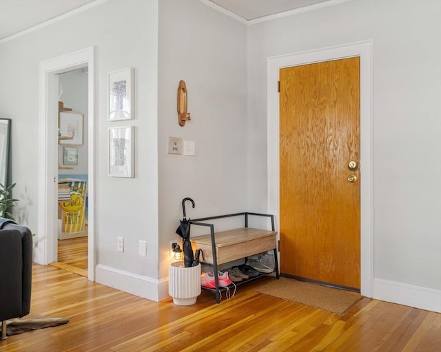 9 Ellery St Unit 33, Cambridge, MA 02138 - foyer featuring crown molding, wood finished floors, and baseboards