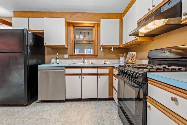 kitchen featuring white cabinetry, black appliances, under cabinet range hood, and a sink