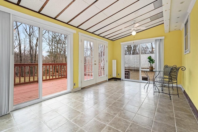 unfurnished sunroom with vaulted ceiling and french doors