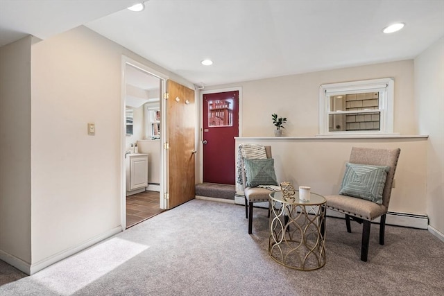 sitting room featuring recessed lighting, baseboards, carpet floors, and a baseboard radiator