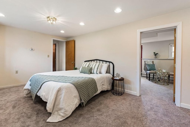 bedroom with baseboards, carpet, and a baseboard radiator