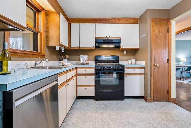 kitchen featuring under cabinet range hood, a sink, black gas range oven, light countertops, and dishwasher