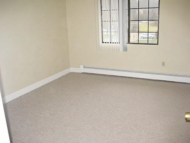 1610 Skyline Dr Unit 11, Lowell, MA 01854 - spare room featuring carpet flooring, a baseboard radiator, and baseboards