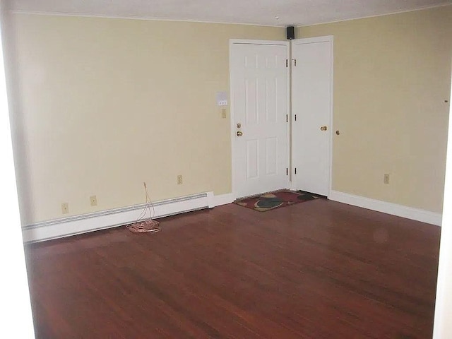1610 Skyline Dr Unit 11, Lowell, MA 01854 - unfurnished room featuring dark wood-type flooring, baseboards, and baseboard heating