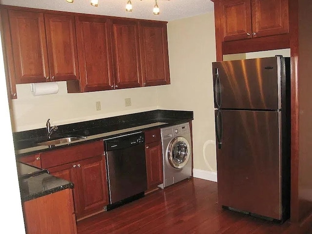 1610 Skyline Dr Unit 11, Lowell, MA 01854 - kitchen featuring freestanding refrigerator, washer / dryer, dishwashing machine, a sink, and dark countertops
