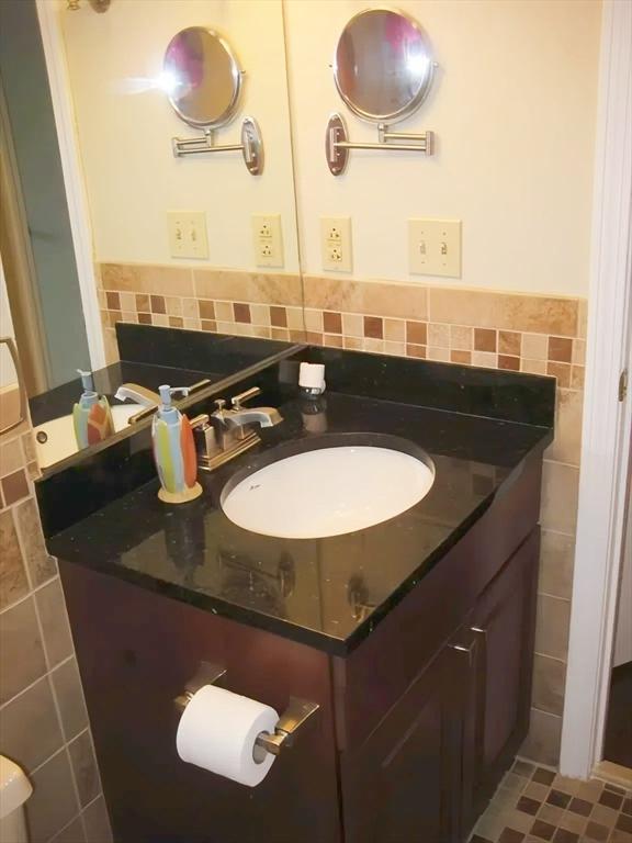1610 Skyline Dr Unit 11, Lowell, MA 01854 - bathroom with tile walls and vanity