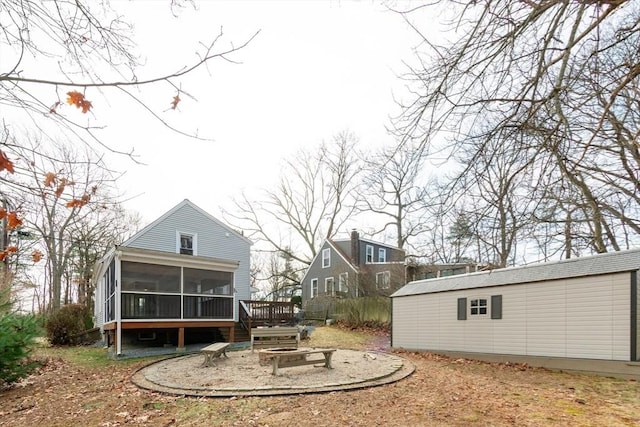 view of yard featuring a sunroom and a deck