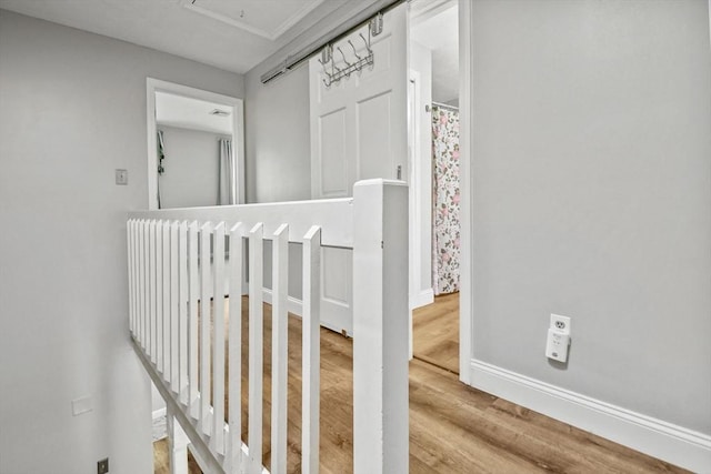 11 Fernwood Dr Unit D, Leominster, MA 01453 - hallway featuring wood finished floors, baseboards, and attic access