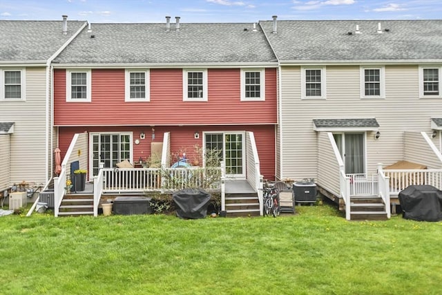 11 Fernwood Dr Unit D, Leominster, MA 01453 - rear view of property with cooling unit, a yard, and a wooden deck