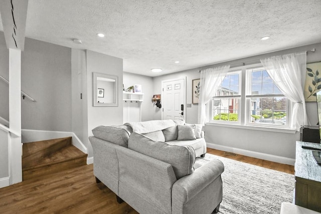 11 Fernwood Dr Unit D, Leominster, MA 01453 - living room featuring baseboards, stairs, wood finished floors, a textured ceiling, and recessed lighting