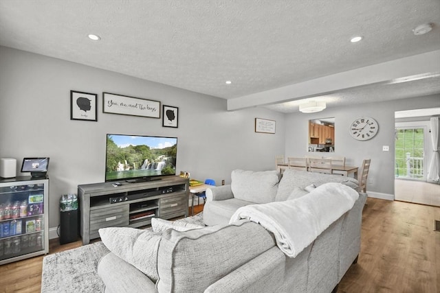 11 Fernwood Dr Unit D, Leominster, MA 01453 - living room with wood finished floors, a textured ceiling, recessed lighting, and baseboards