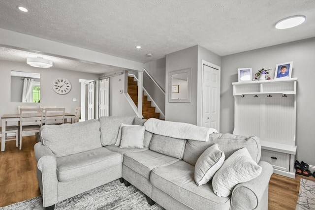 11 Fernwood Dr Unit D, Leominster, MA 01453 - living area with a textured ceiling, stairs, wood finished floors, recessed lighting, and baseboards