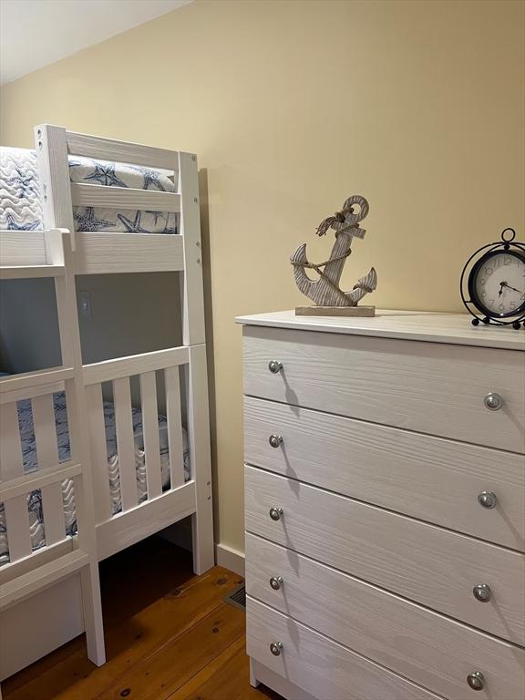 168 N Shore Blvd Unit 12, Sandwich, MA 02537 - bedroom with dark wood-style flooring and vaulted ceiling