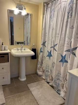 168 N Shore Blvd Unit 12, Sandwich, MA 02537 - bathroom with tile patterned floors and a shower with curtain