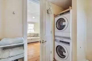 168 N Shore Blvd Unit 12, Sandwich, MA 02537 - laundry area featuring stacked washing maching and dryer and laundry area