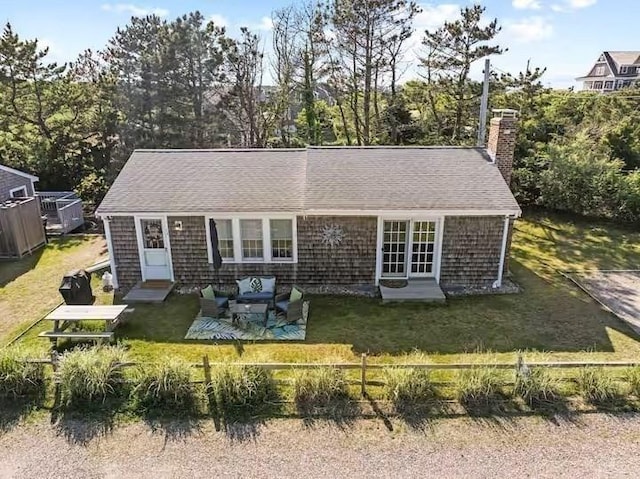 168 N Shore Blvd Unit 12, Sandwich, MA 02537 - back of house featuring an outdoor living space, a yard, a chimney, and entry steps