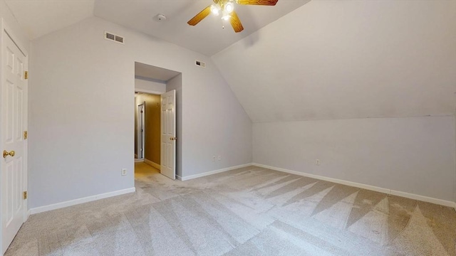 bonus room featuring baseboards, visible vents, a ceiling fan, and vaulted ceiling