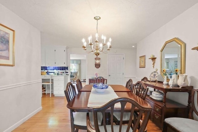8 Viking Rock Rd, Yarmouth, MA 02664 - dining area with a chandelier and light wood finished floors