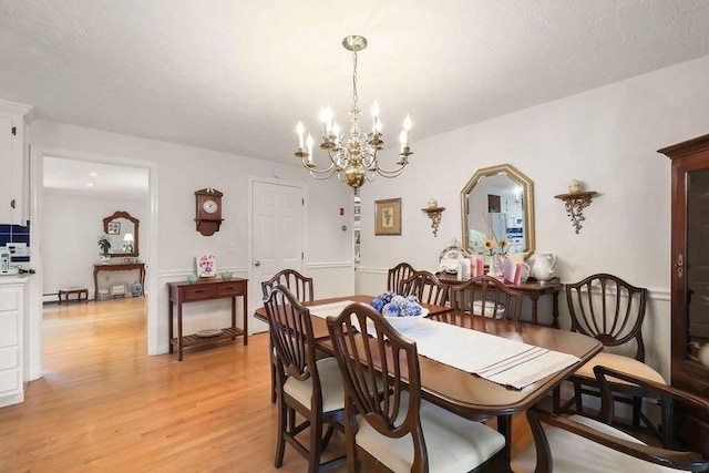 8 Viking Rock Rd, Yarmouth, MA 02664 - dining space with a chandelier and light wood-type flooring