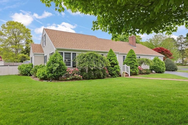8 Viking Rock Rd, Yarmouth, MA 02664 - view of front facade with a chimney and a shingled roof
