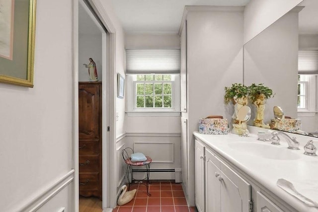 8 Viking Rock Rd, Yarmouth, MA 02664 - bathroom with a baseboard radiator, vanity, and a decorative wall