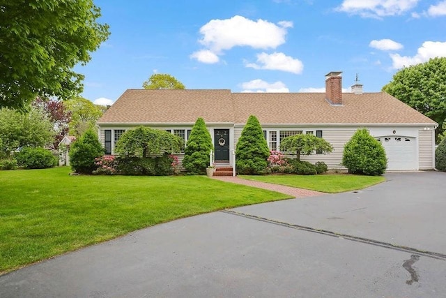 8 Viking Rock Rd, Yarmouth, MA 02664 - view of front facade with a front lawn, a chimney, asphalt driveway, and an attached garage