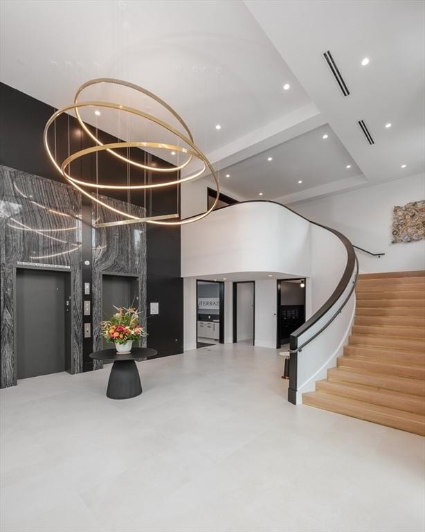 100 Linden St Unit 103, Wellesley, MA 02482 - building lobby with a high ceiling, recessed lighting, and stairway