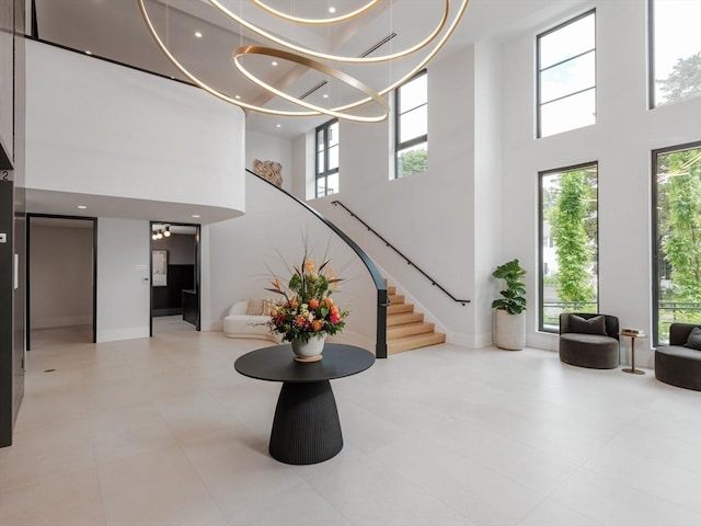 100 Linden St Unit 103, Wellesley, MA 02482 - common area with a towering ceiling, stairway, and recessed lighting