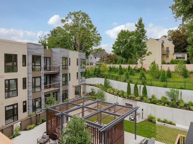 100 Linden St Unit 103, Wellesley, MA 02482 - view of property featuring fence and a residential view