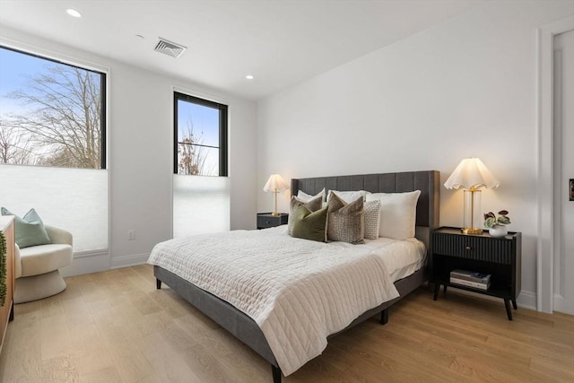 100 Linden St Unit 103, Wellesley, MA 02482 - bedroom featuring light wood-style flooring, recessed lighting, and baseboards