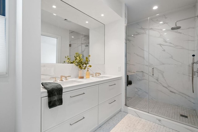 100 Linden St Unit 103, Wellesley, MA 02482 - full bath with a marble finish shower, recessed lighting, and double vanity