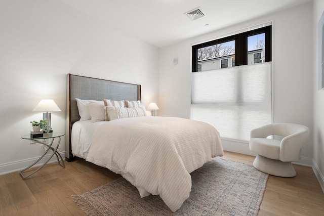 100 Linden St Unit 103, Wellesley, MA 02482 - bedroom featuring wood finished floors and baseboards