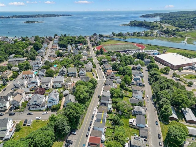 birds eye view of property with a water view and a residential view