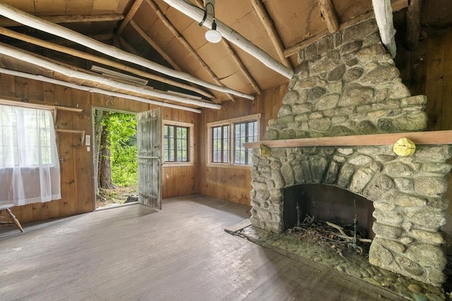 731-R Grove St, Norwell, MA 02061 - unfurnished living room featuring lofted ceiling, wood walls, hardwood / wood-style flooring, and a fireplace