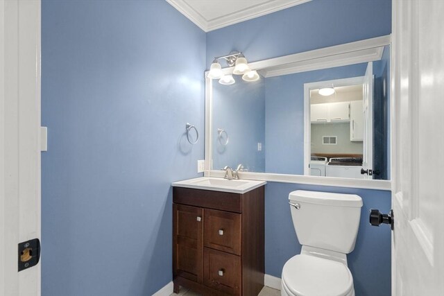 731-R Grove St, Norwell, MA 02061 - bathroom featuring washer and clothes dryer, vanity, and crown molding