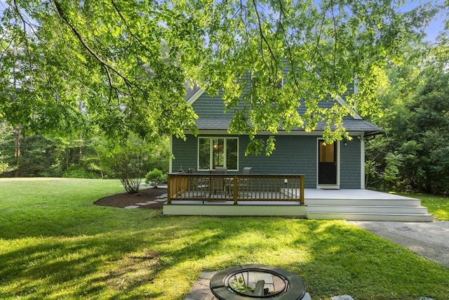 731-R Grove St, Norwell, MA 02061 - back of house featuring a yard, a deck, a fire pit, and roof with shingles
