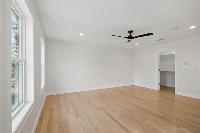 unfurnished room featuring recessed lighting, light wood-type flooring, baseboards, and a ceiling fan