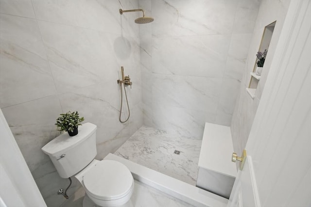 full bath with toilet and a tile shower