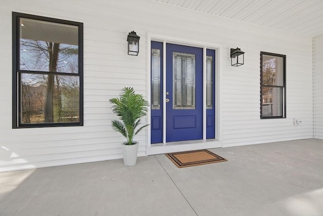 doorway to property with a porch