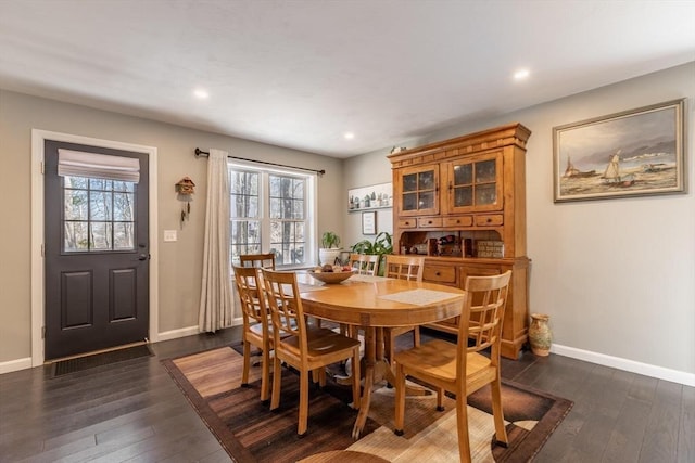 dining room with recessed lighting, dark wood-style floors, and baseboards