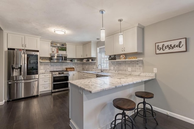 kitchen featuring backsplash, appliances with stainless steel finishes, a peninsula, and open shelves