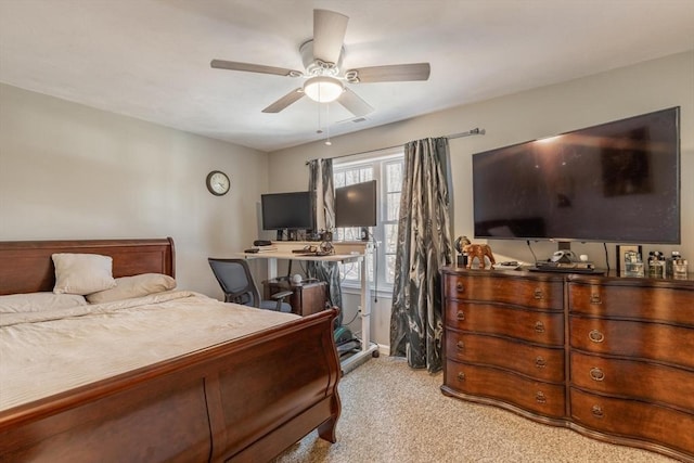 bedroom featuring a ceiling fan and light colored carpet