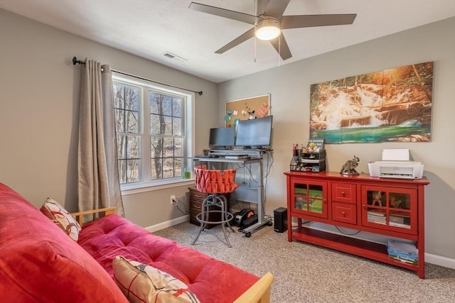 interior space with visible vents, baseboards, ceiling fan, and carpet flooring