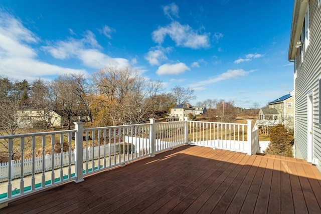 wooden deck with a swimming pool