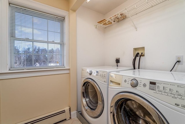 washroom with independent washer and dryer and a baseboard heating unit