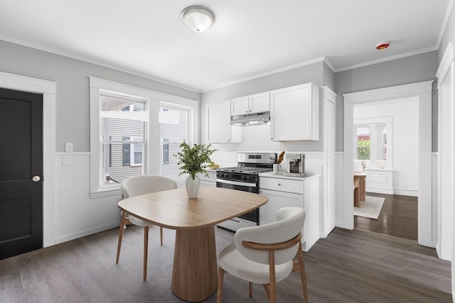 75 Norcross St, Lowell, MA 01851 - dining area featuring dark wood-type flooring, crown molding, and a wainscoted wall