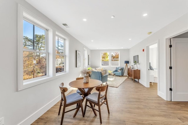 dining area featuring light wood-type flooring