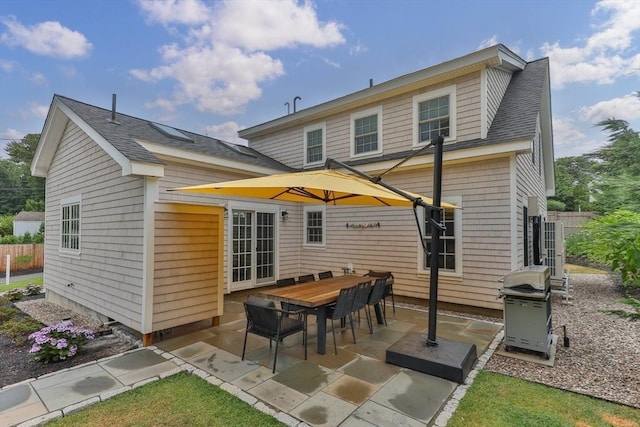 rear view of property featuring a patio