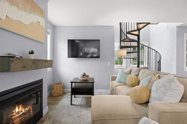 living room featuring light hardwood / wood-style floors and a wealth of natural light